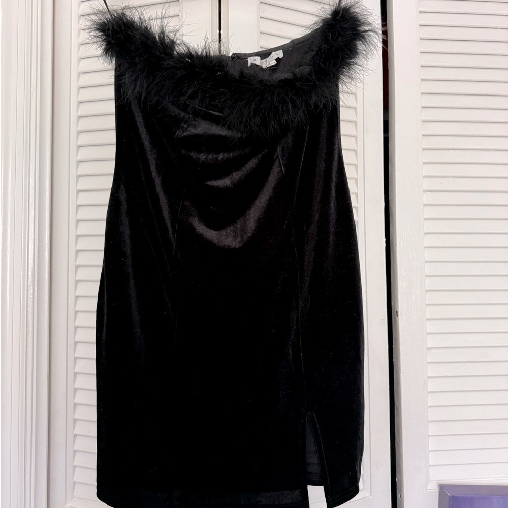 Black sexy dress with feathery border on the chest area.